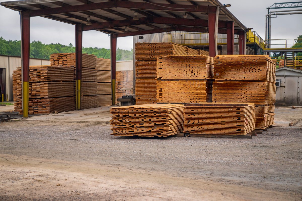 Stacks of clean wood lumber, a construction material that can be recycled