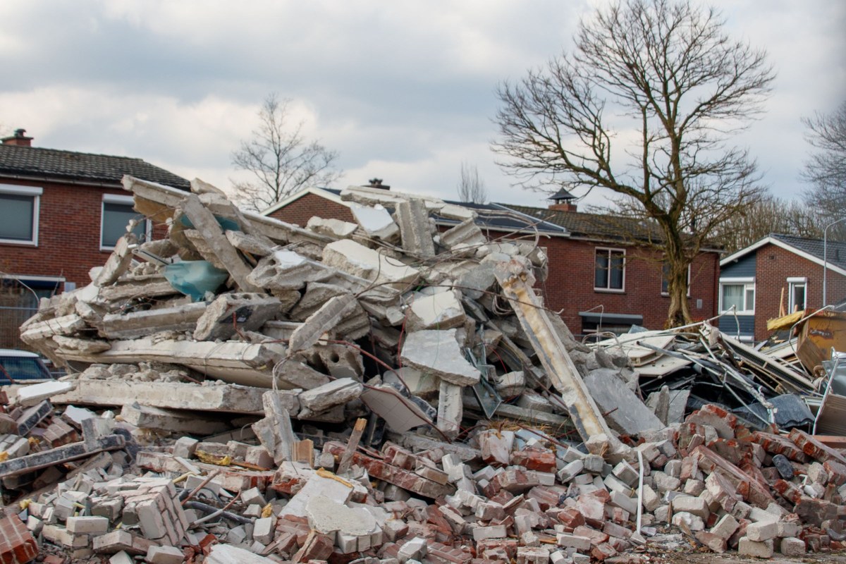 Piles of broken concrete and brick rubble from demolition