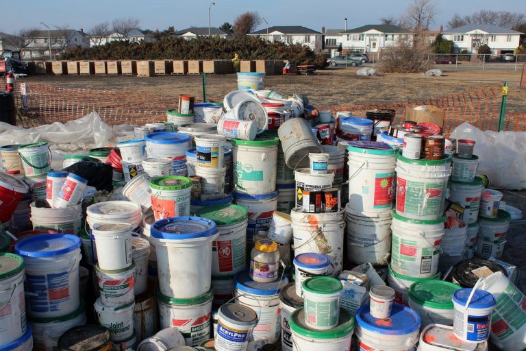 Household hazardous waste such as paint and chemical containers sorted for proper disposal